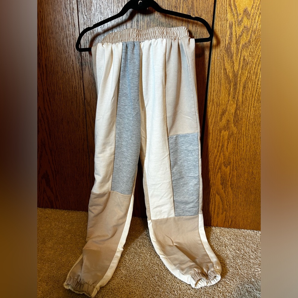 Tan, grey, and white color block sweatpants size medium.